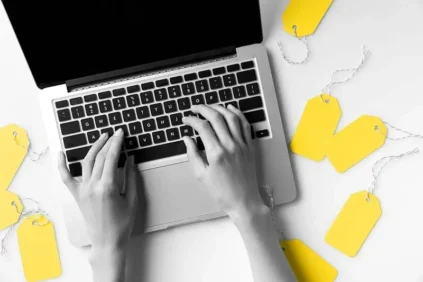 Image of a laptop and yellow tags