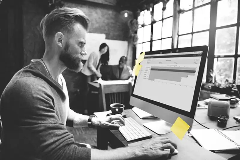 Man typing on laptop