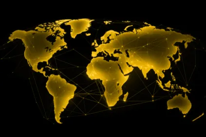 Map of the world in gold over black background